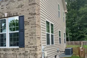 Image of residential stucco siding after soft washing services from Softwash Platoon