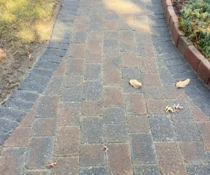 A newly restored residential walkway made out of pavers